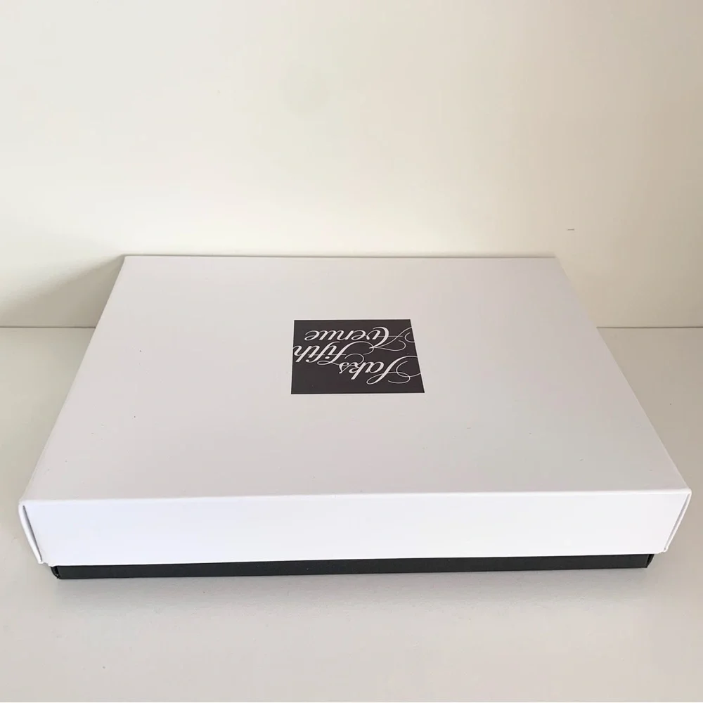 Hold Saks Fifth Avenue gift boxes